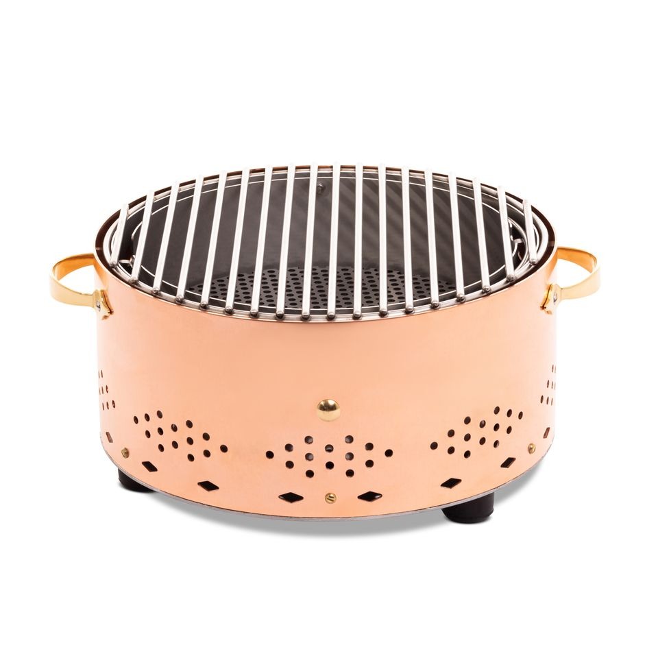 Grille ronde, finition cuivre, gros plan sur la structure rivetée
